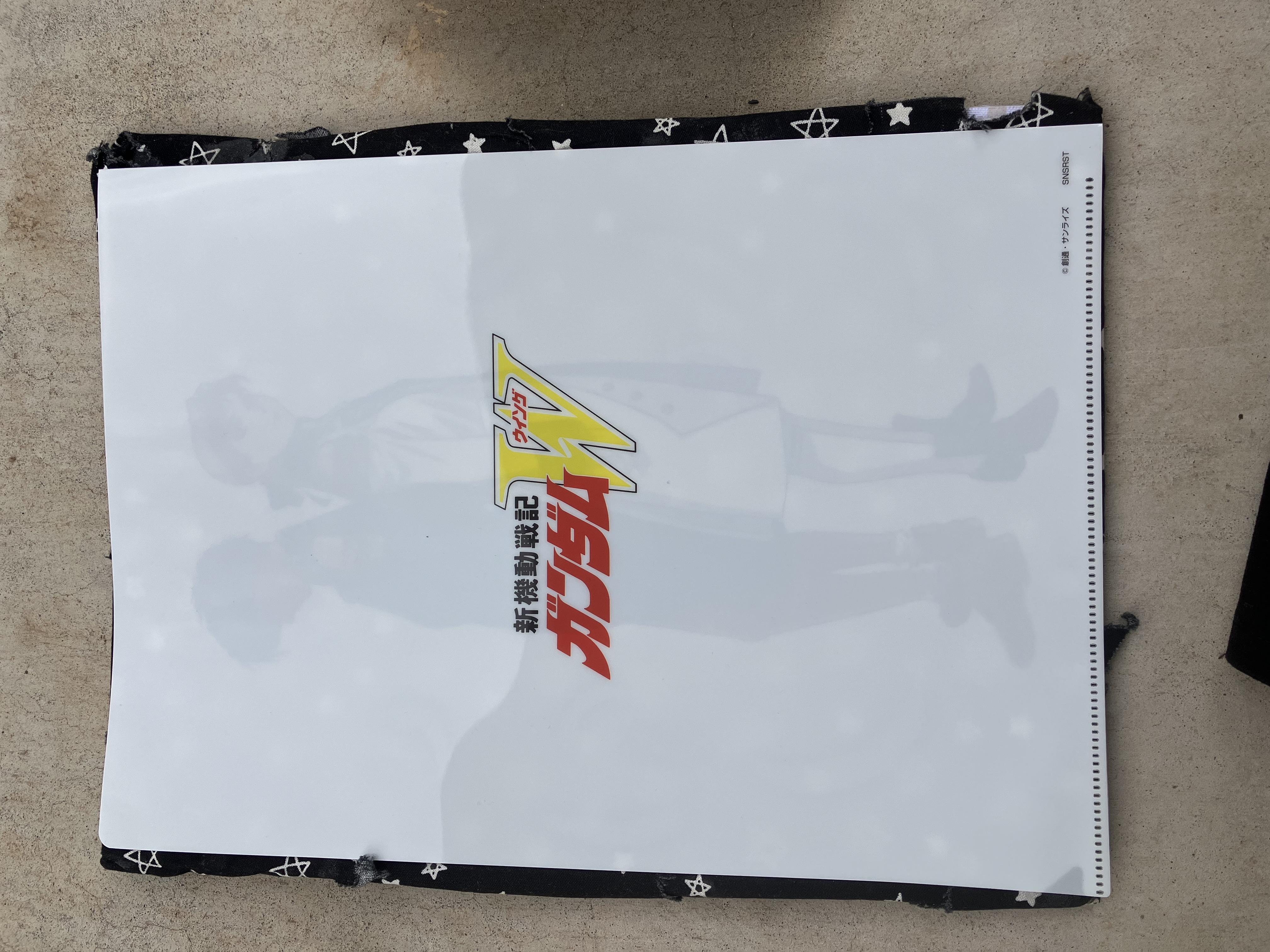 Back of clear file with Gundam wing logo.
